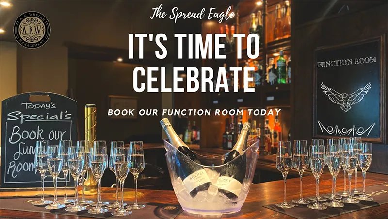 A bar laid with prosecco flutes and an ice bucket, with a chalkboard reading Function Room behind