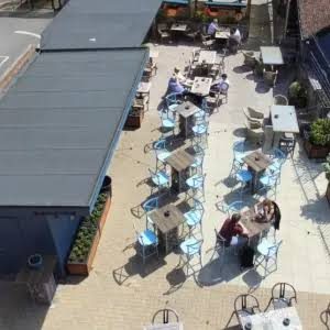 The Foundry's beer garden seen from above: tables and parasols across the terrace, with drinkers at the tables